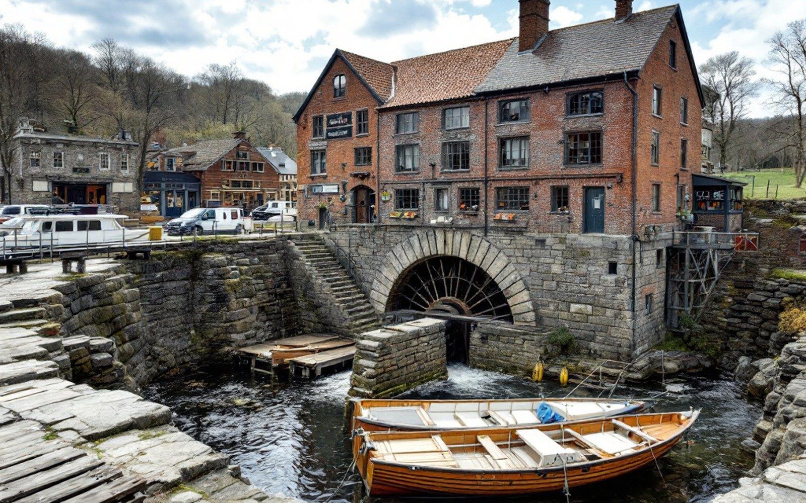 A stone wheel pit and sluice gate below a building